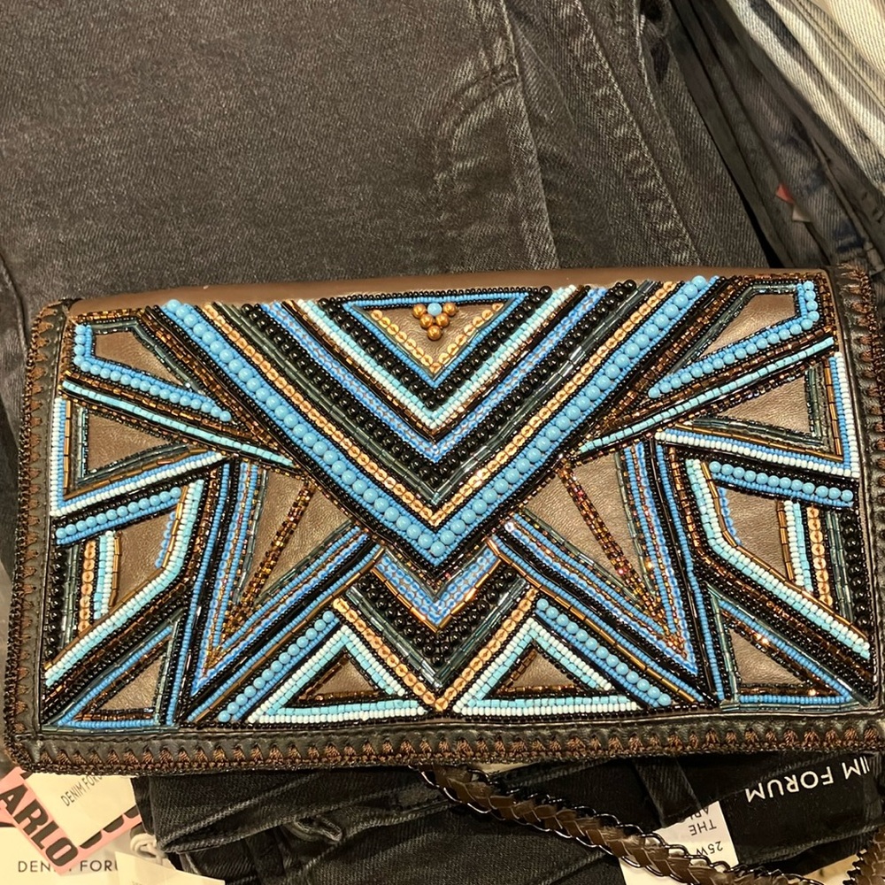 Buba London brown leather beaded clutch with chain shoulder strap. Barely worn.